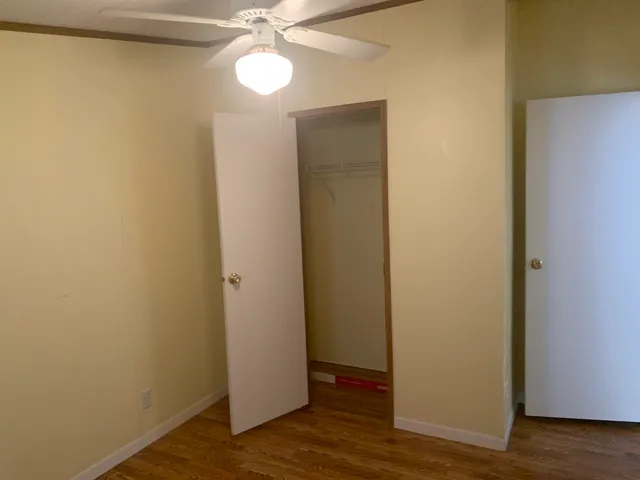 a white toilet sitting next to a bathroom sink