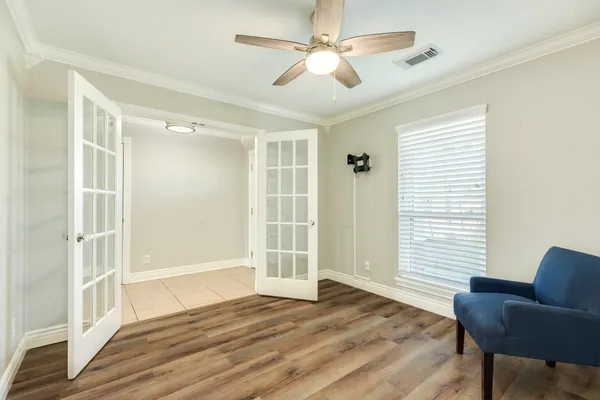 a view of livingroom with hardwood floor and a ceiling fan