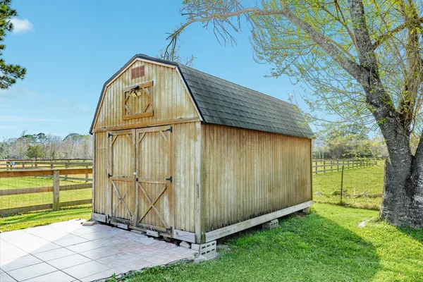 a view of a backyard with a barn