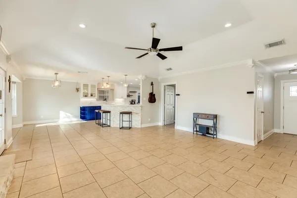 a view of kitchen with furniture and a chandelier