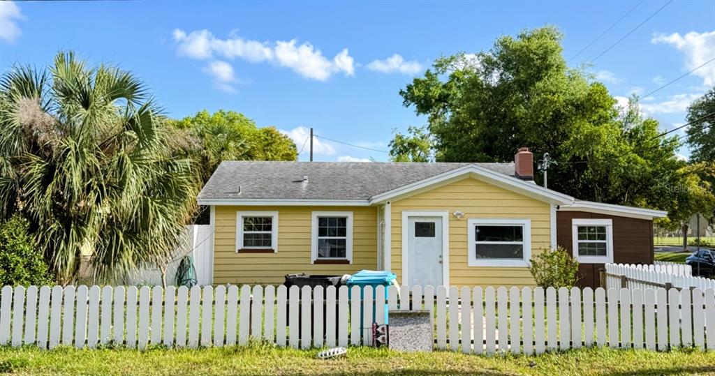 644 Indiana Street Orlando, FL 32805 - Photo 1 of 15 a front view of a house with a garden