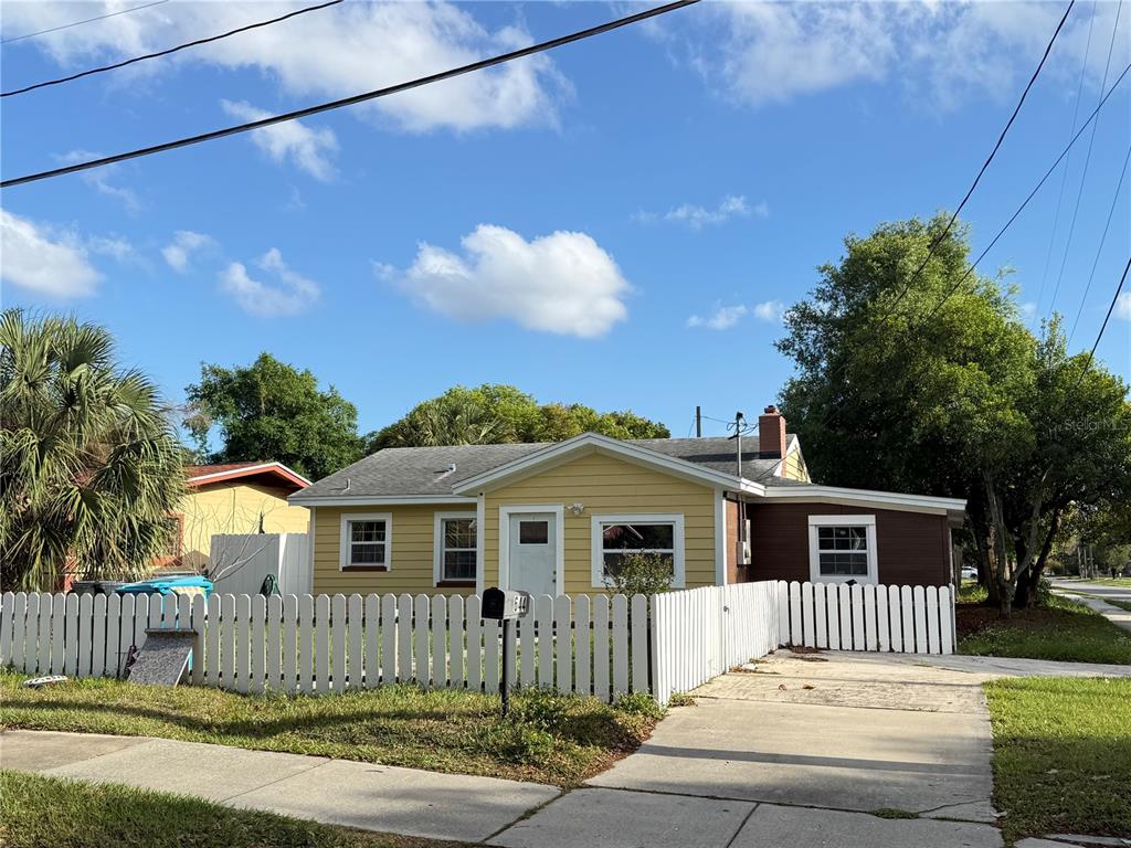 644 Indiana Street Orlando, FL 32805 - Photo 14 of 15 a front view of a house with a yard