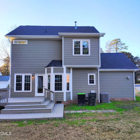 a view of porch with a bench