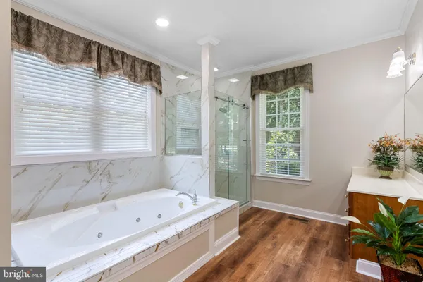 a bathroom with a bathtub and a sink