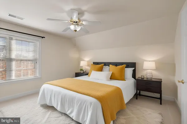 a bedroom with a bed and window