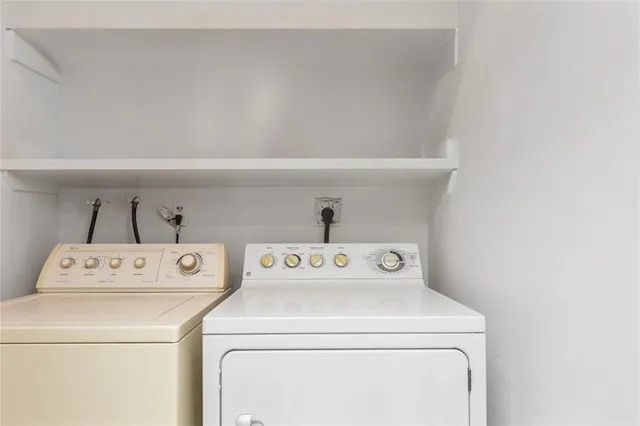 a kitchen with granite countertop white cabinets and a sink