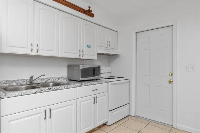 a bathroom with a toilet and shower curtain