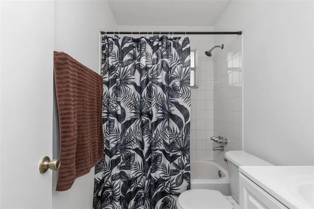 a living room with furniture flowerpot and window