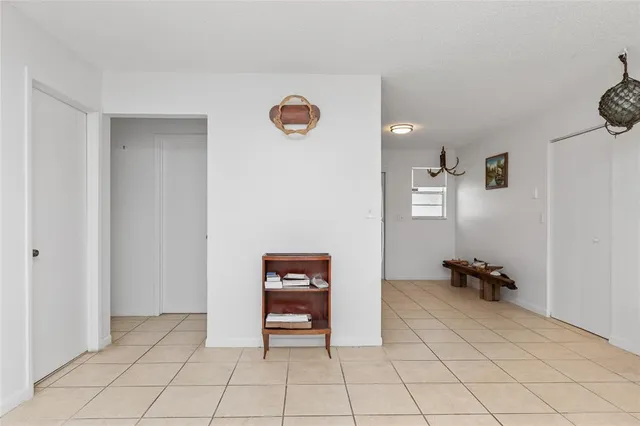a view of game room with windows and air conditioner