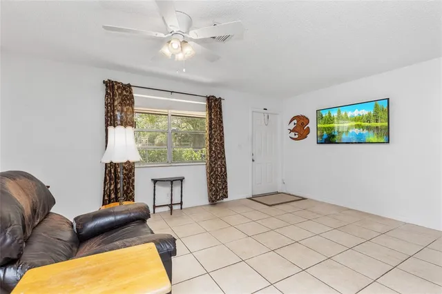 a kitchen with a refrigerator and cabinets