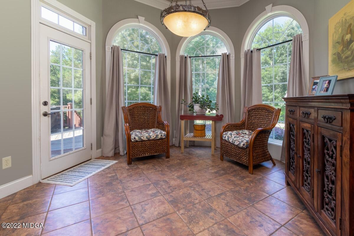 500 River Walk Forsyth, GA 31029 - Photo 12 of 31 a living room with furniture and a floor to ceiling window