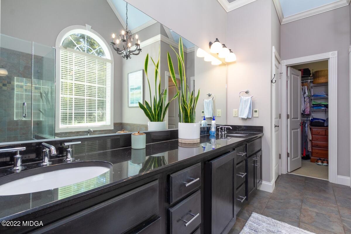 500 River Walk Forsyth, GA 31029 - Photo 16 of 31 a bathroom with double vanity sinks a vanity and a large mirror