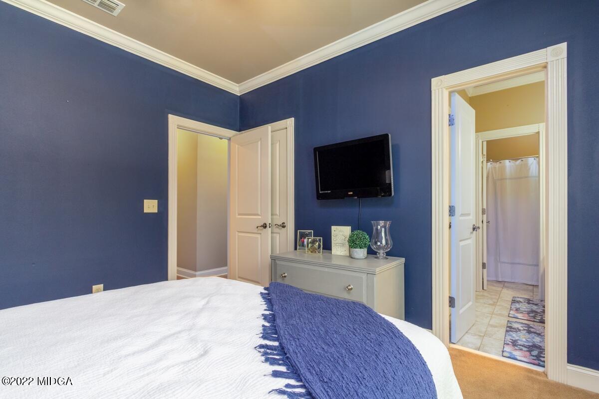 500 River Walk Forsyth, GA 31029 - Photo 18 of 31 a bedroom with a bed and a flat screen tv