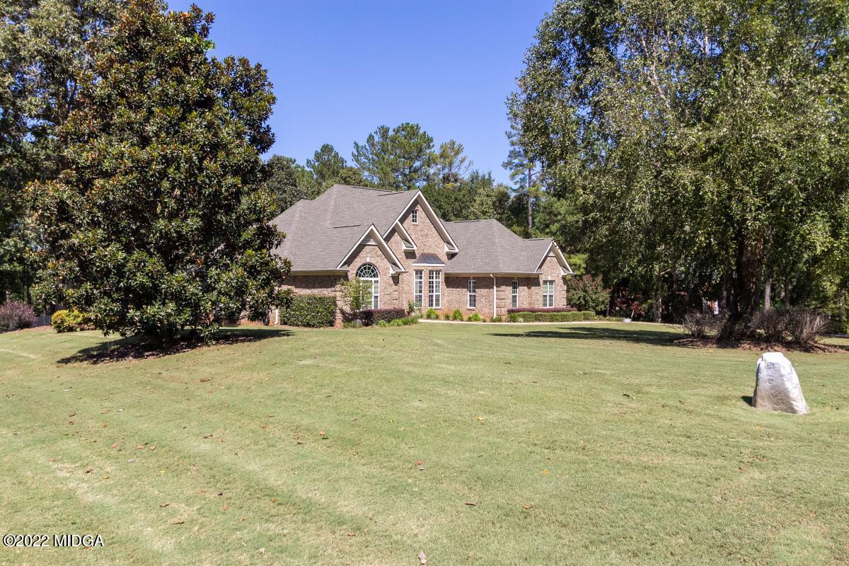 500 River Walk Forsyth, GA 31029 - Photo 2 of 31 a view of a house with a yard and tree s