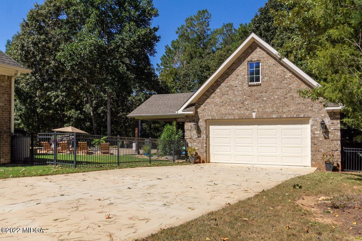 500 River Walk Forsyth, GA 31029 - Photo 28 of 31 a view of a house with a yard and lawn chairs