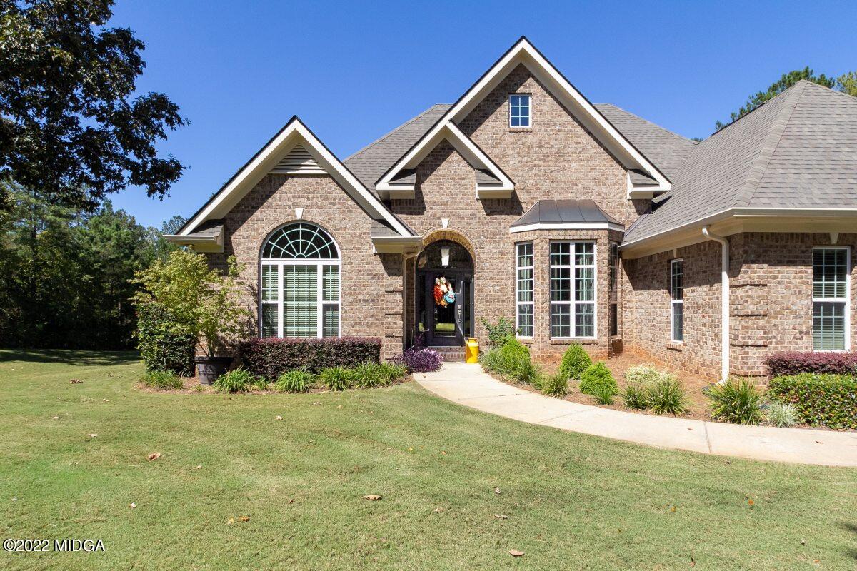 500 River Walk Forsyth, GA 31029 - Photo 3 of 31 a front view of a house with a yard and garage