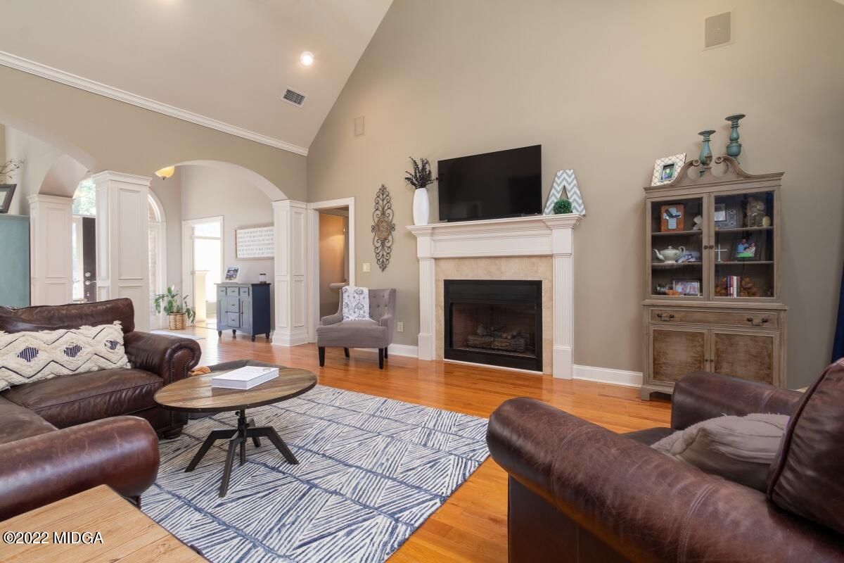 500 River Walk Forsyth, GA 31029 - Photo 7 of 31 a living room with furniture a rug and a fireplace