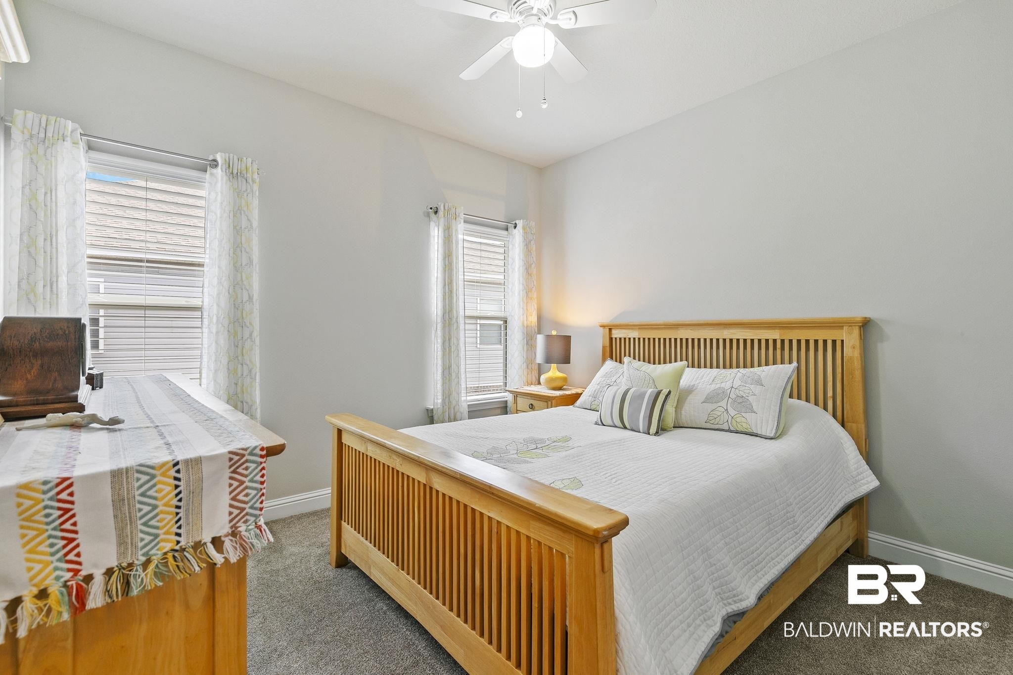 6867 Spaniel Drive, Unit B Daphne, AL 36527 - Photo 19 of 36 Bedroom with carpet flooring, multiple windows, and ceiling fan