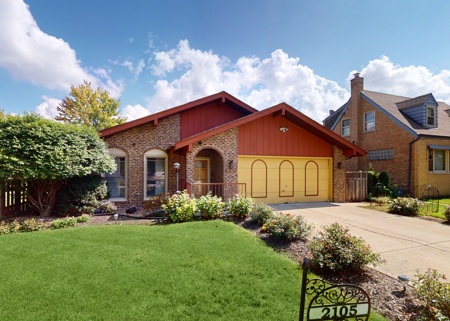 a front view of a house with garden
