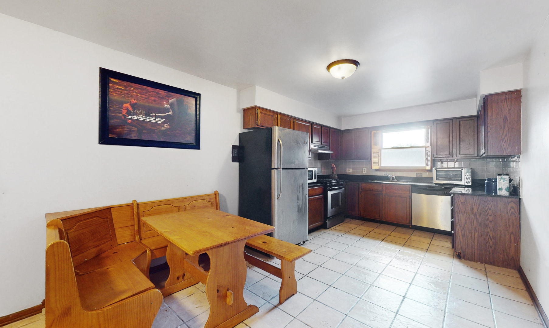 2105 16th Avenue Broadview, IL 60155 - Photo 7 of 26 a kitchen with stainless steel appliances granite countertop a refrigerator and a stove top oven