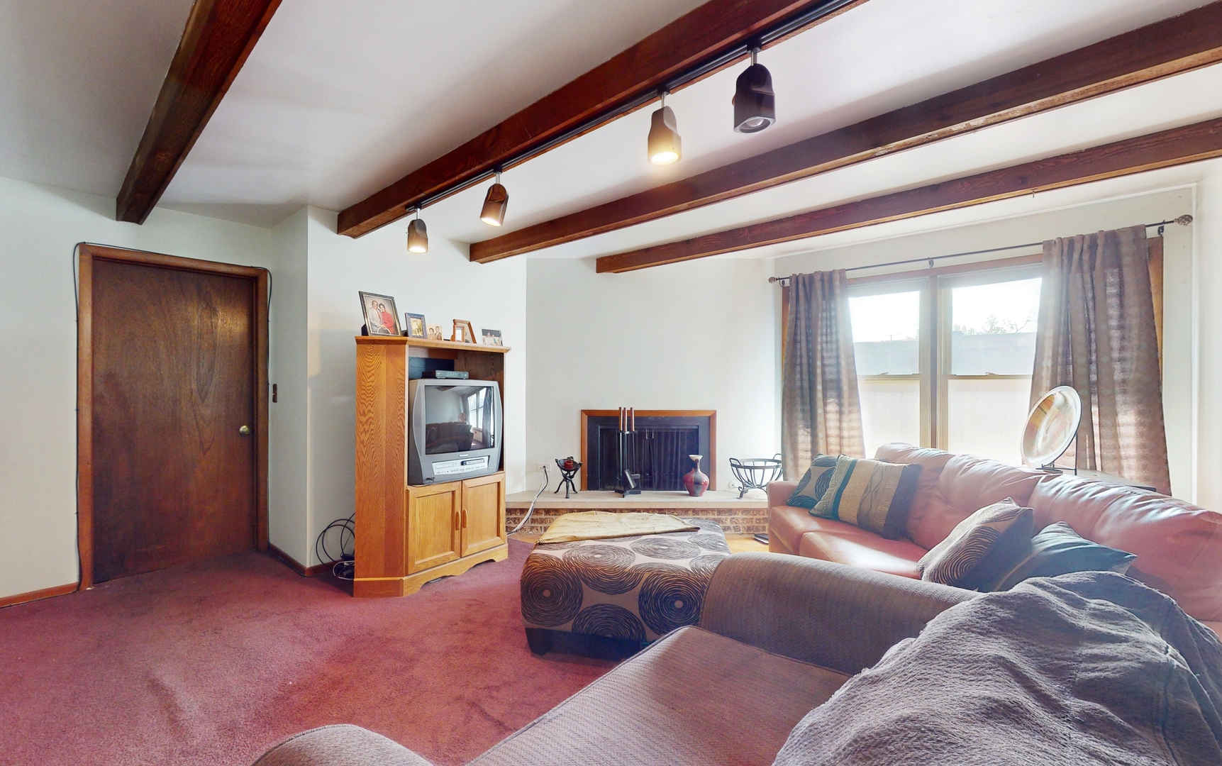 2105 16th Avenue Broadview, IL 60155 - Photo 9 of 26 a living room with furniture and a large window