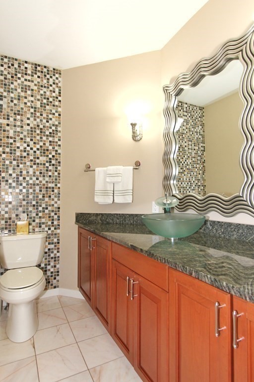 44 Whisper Drive Worcester, MA 01609 - Photo 13 of 40 a bathroom with a granite countertop sink and a toilet