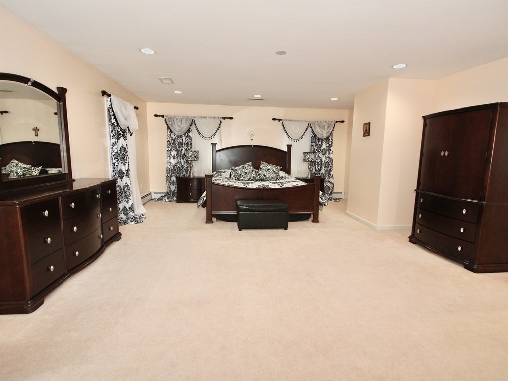 44 Whisper Drive Worcester, MA 01609 - Photo 18 of 40 a living room with furniture and a flat screen tv