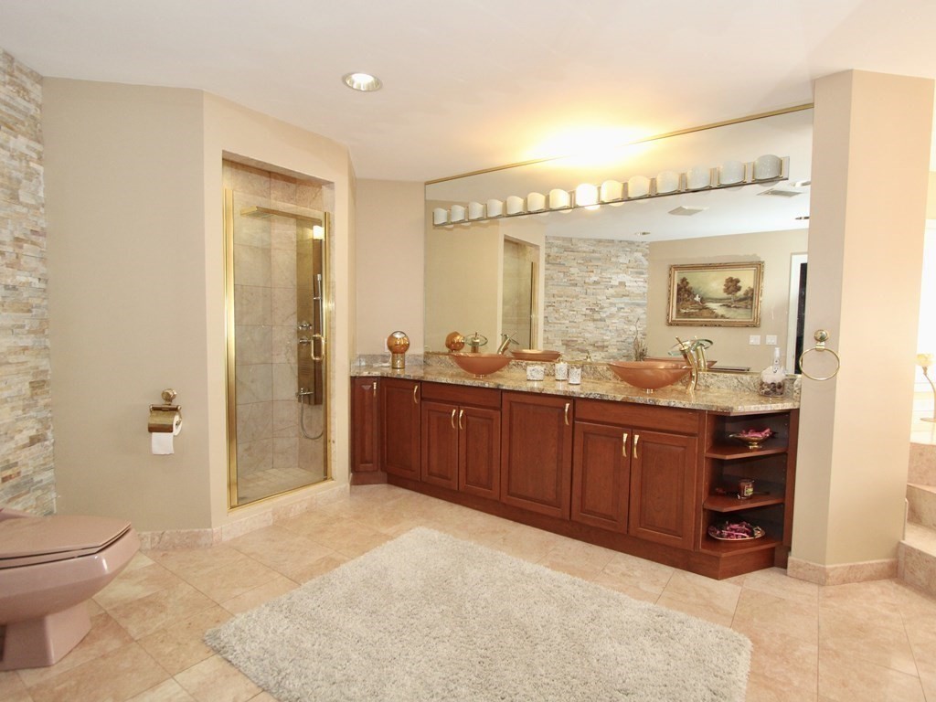 44 Whisper Drive Worcester, MA 01609 - Photo 19 of 40 a spacious bathroom with a granite countertop sink and a mirror