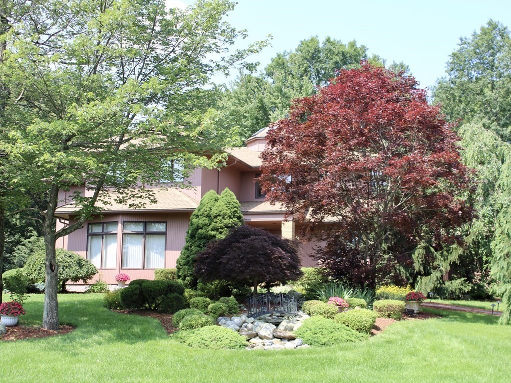 44 Whisper Drive Worcester, MA 01609 - Photo 2 of 40 a front view of a house with garden