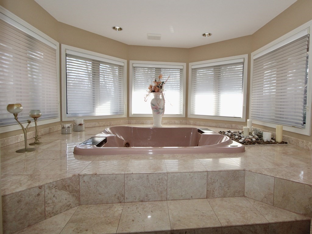 44 Whisper Drive Worcester, MA 01609 - Photo 21 of 40 a large bathroom with a tub a sink and mirror