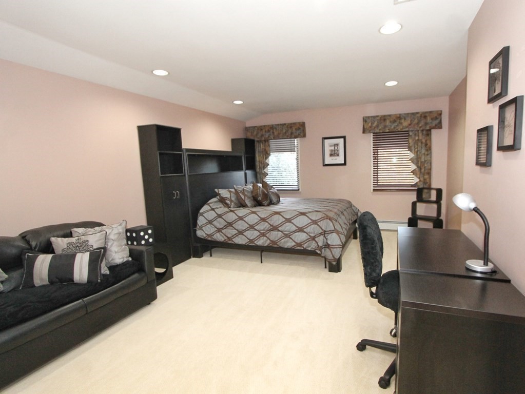 44 Whisper Drive Worcester, MA 01609 - Photo 23 of 40 a bedroom with a bed and wooden floor