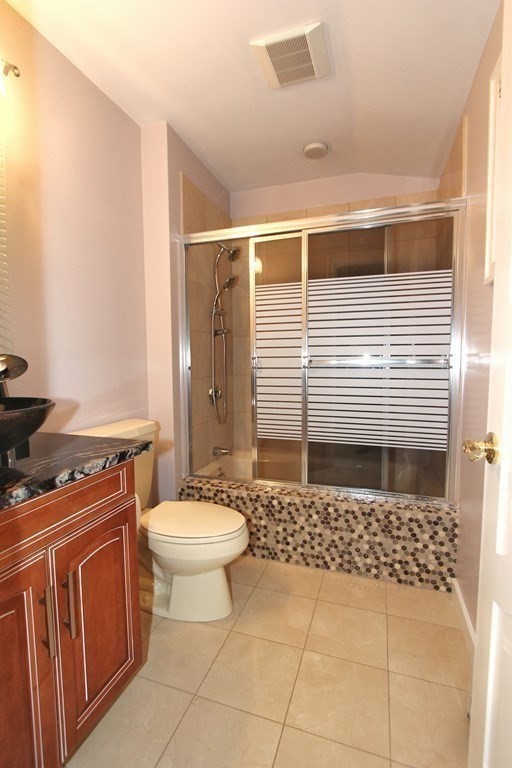 44 Whisper Drive Worcester, MA 01609 - Photo 24 of 40 a bathroom with a sink a toilet and shower