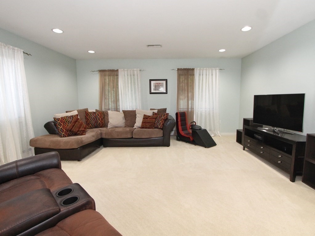 44 Whisper Drive Worcester, MA 01609 - Photo 29 of 40 a living room with furniture and a flat screen tv