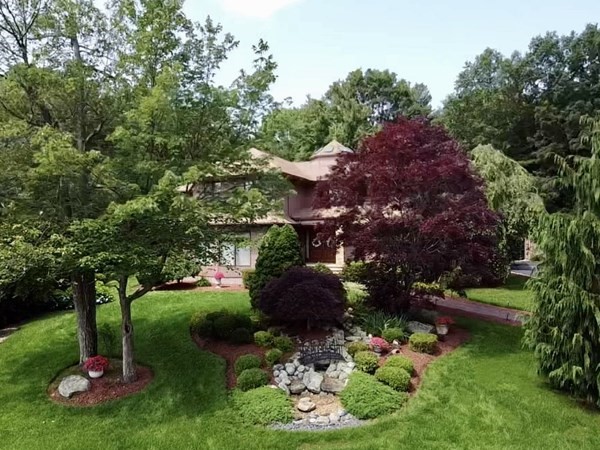 44 Whisper Drive Worcester, MA 01609 - Photo 36 of 40 a view of garden with flowers and trees