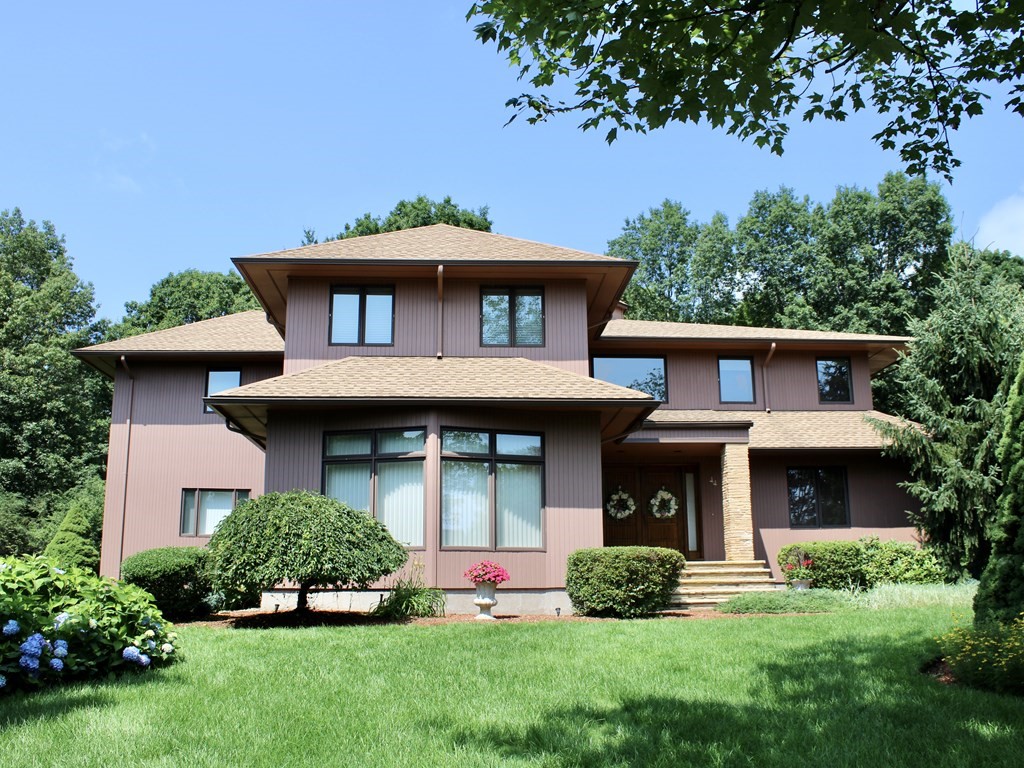 44 Whisper Drive Worcester, MA 01609 - Photo 40 of 40 a front view of a house with a yard and trees