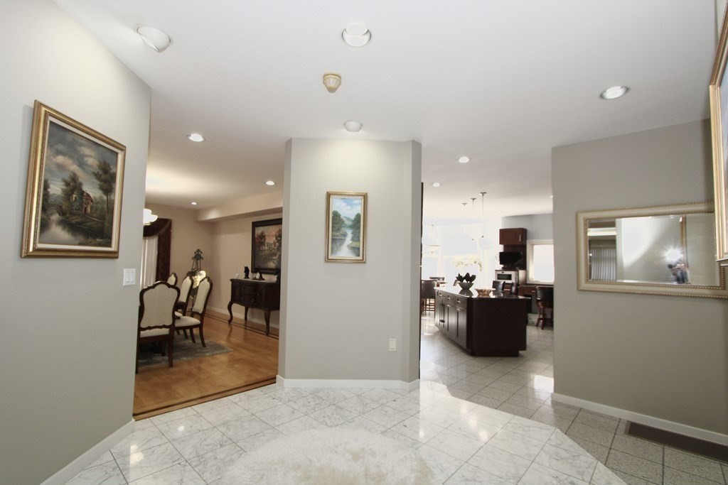44 Whisper Drive Worcester, MA 01609 - Photo 6 of 40 a living room with furniture a dining table and kitchen view