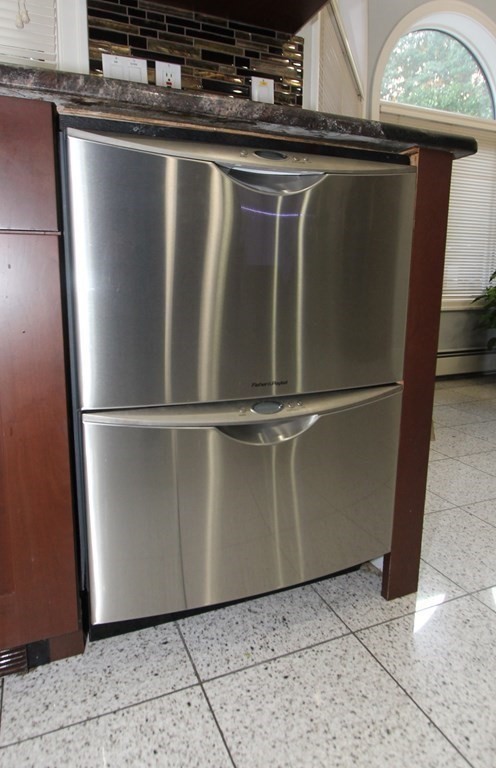 44 Whisper Drive Worcester, MA 01609 - Photo 9 of 40 a close view of a refrigerator a oven and a window