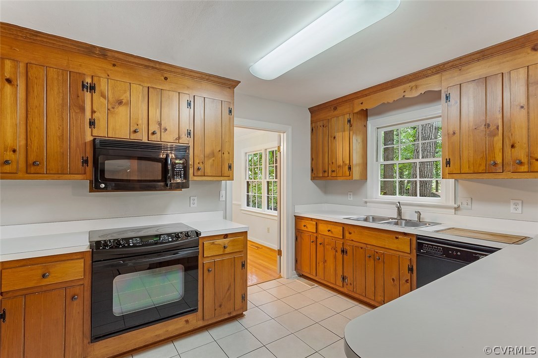 13105 Bluemont Road Chester, VA 23831 - Photo 11 of 29 a kitchen with stainless steel appliances granite countertop a stove a sink and a microwave