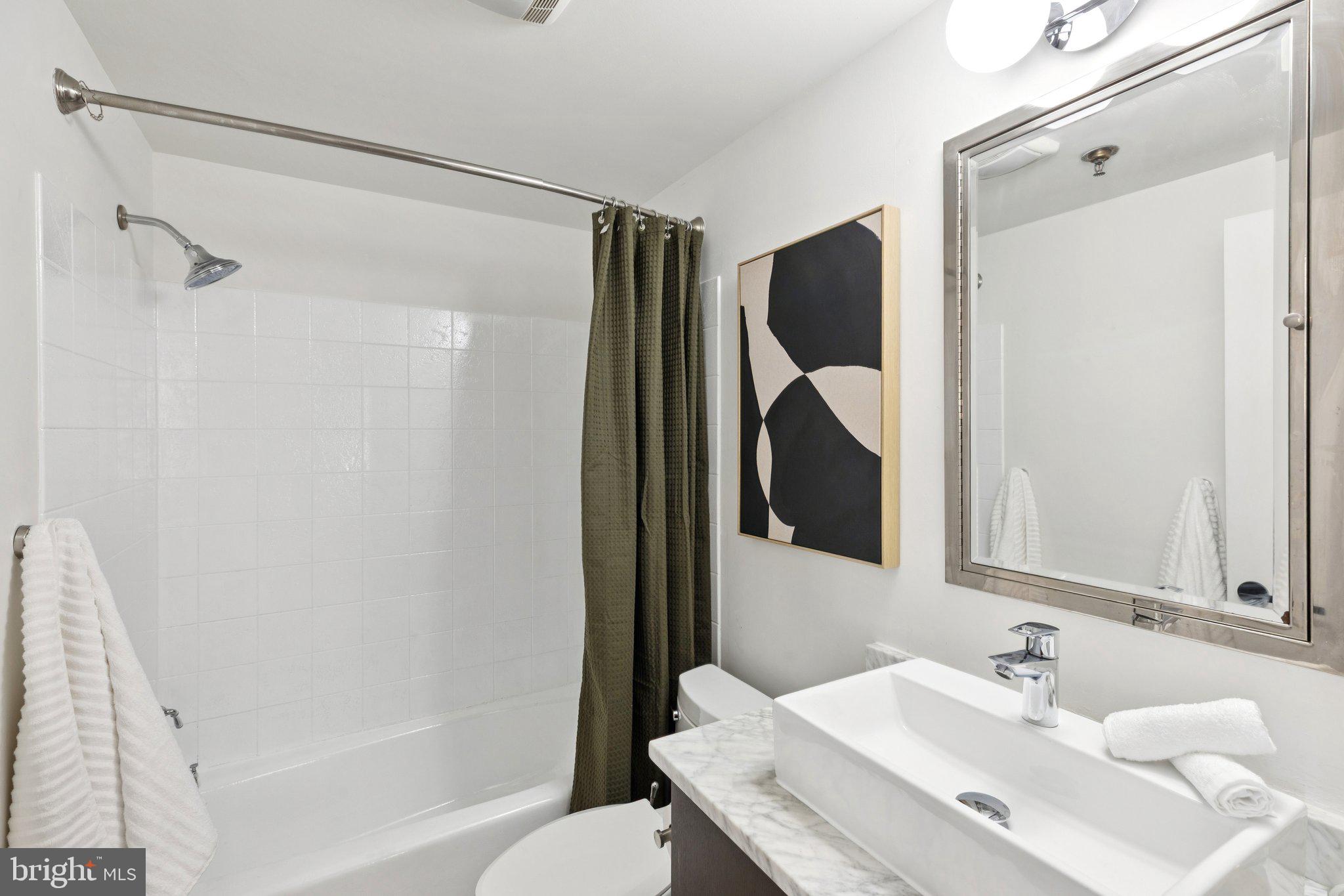 205 Cuthbert Street, Unit 301 Philadelphia, PA 19106 - Photo 13 of 25 a bathroom with a sink and a mirror