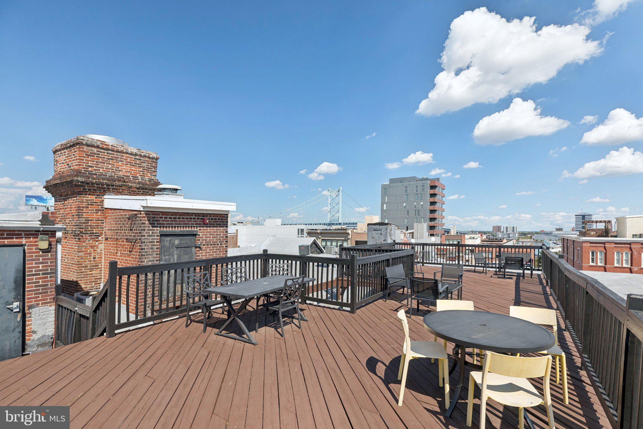 205 Cuthbert Street, Unit 301 Philadelphia, PA 19106 - Photo 20 of 25 a view of a roof deck with table and chairs