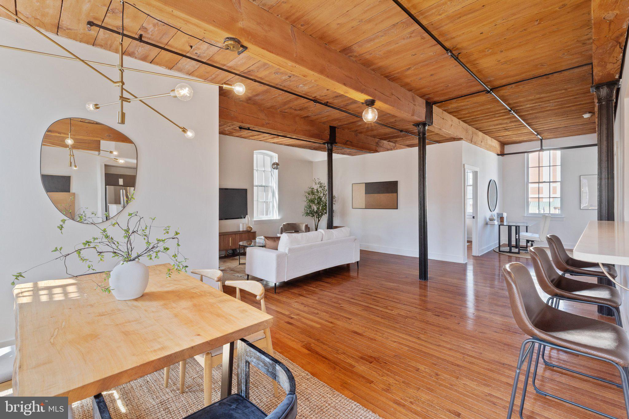 205 Cuthbert Street, Unit 301 Philadelphia, PA 19106 - Photo 2 of 25 a living room with furniture and wooden floor