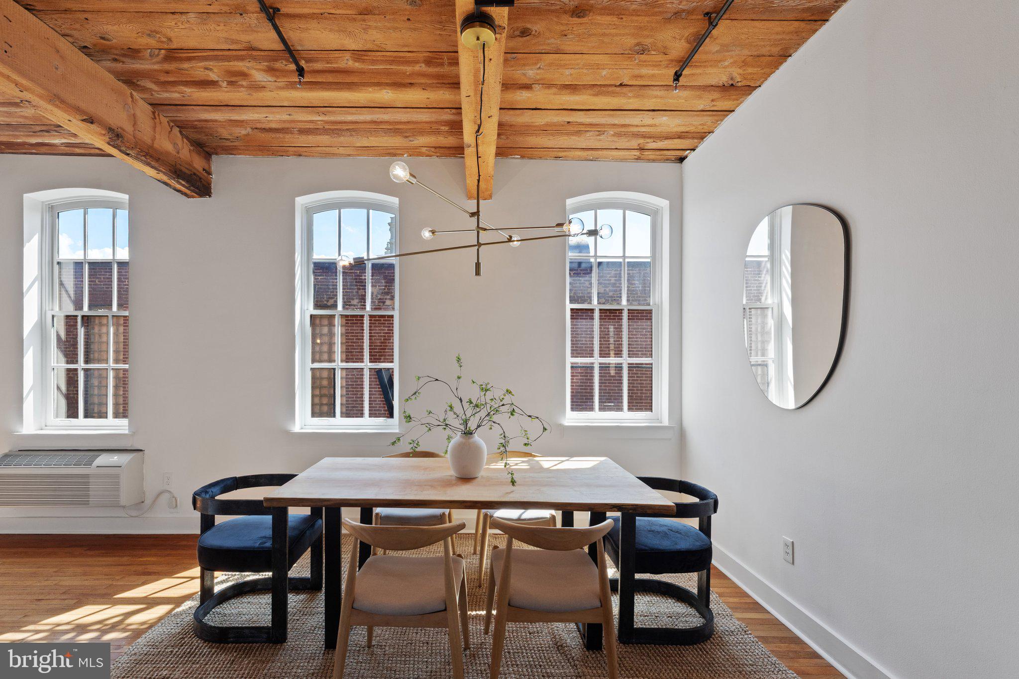 205 Cuthbert Street, Unit 301 Philadelphia, PA 19106 - Photo 4 of 25 a view of a dining room with furniture and window