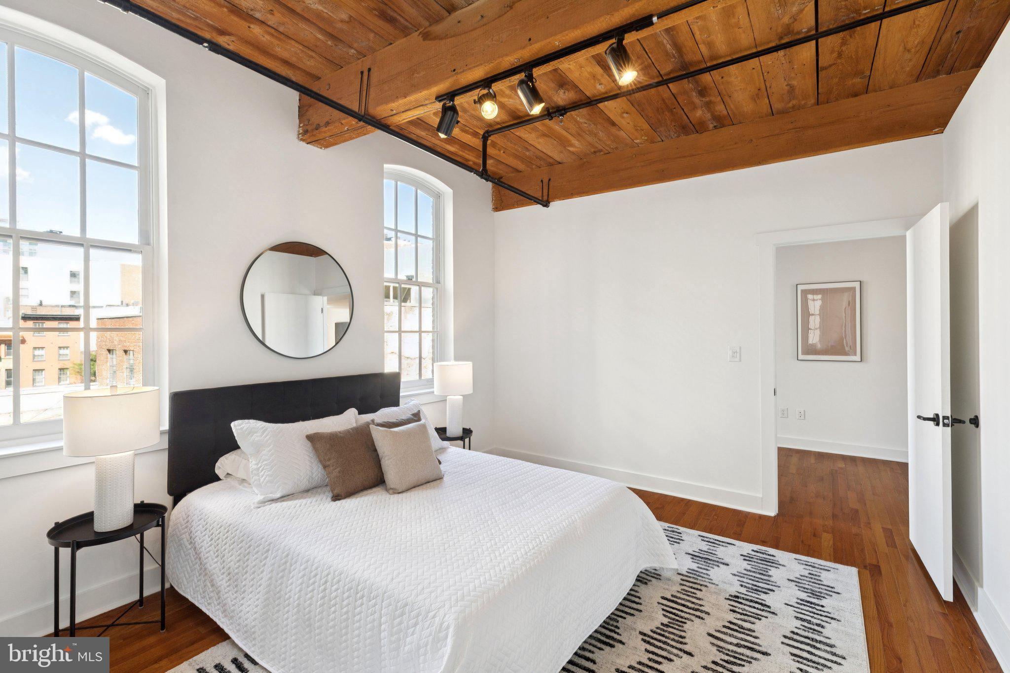 205 Cuthbert Street, Unit 301 Philadelphia, PA 19106 - Photo 8 of 25 a bedroom with bed and a window