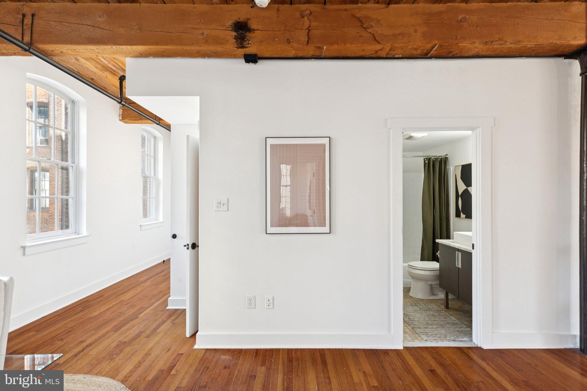 205 Cuthbert Street, Unit 301 Philadelphia, PA 19106 - Photo 10 of 25 wooden floor in a white room