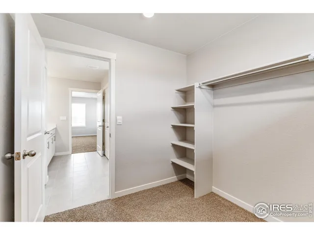a view of a bedroom from the hallway