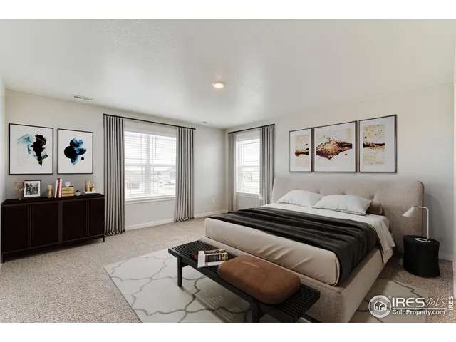 a bedroom with a bed and a cabinets