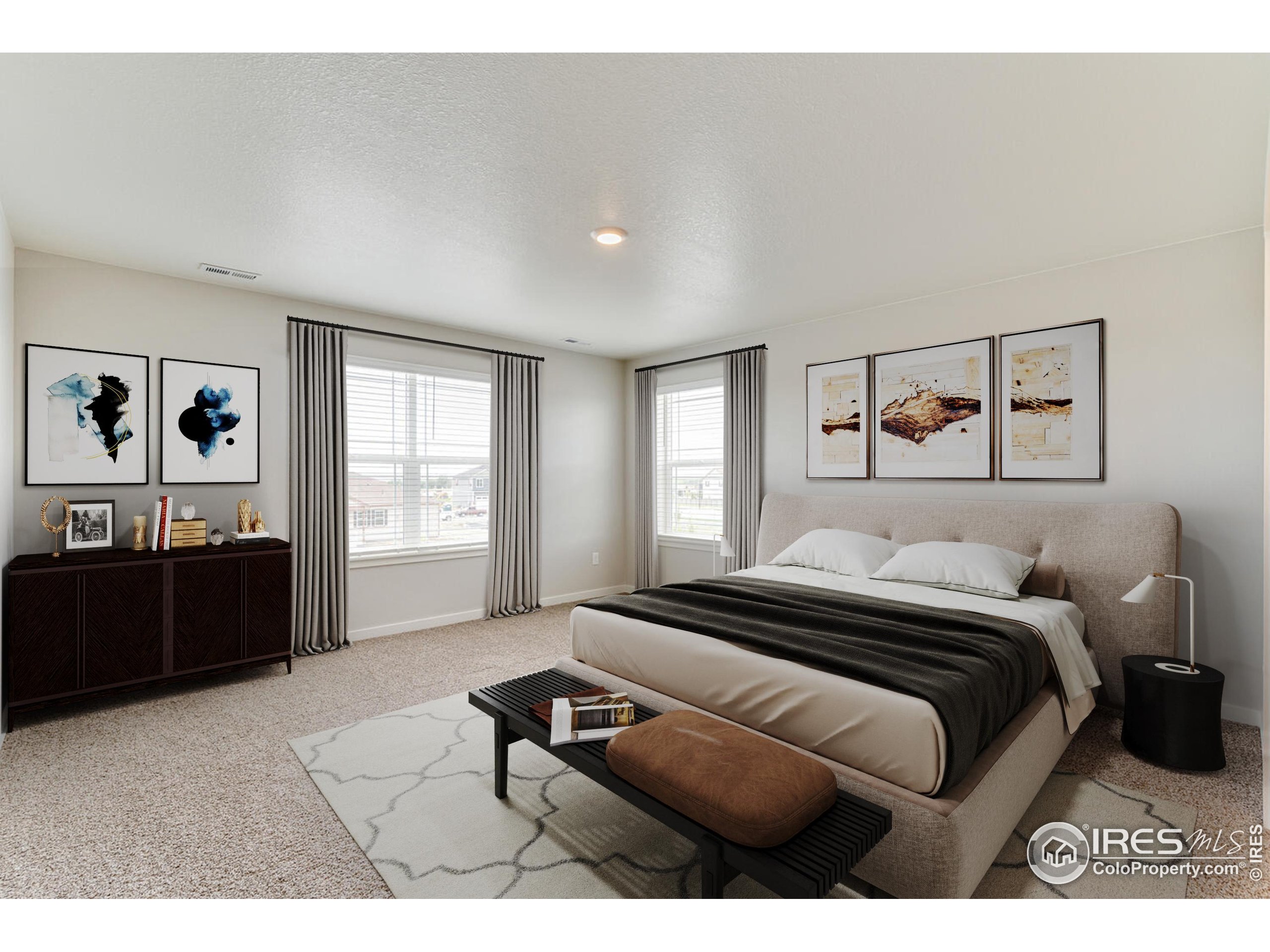 1894 Chaffee Crest Drive Berthoud, CO 80513 - Photo 2 of 31 a bedroom with a bed and a cabinets