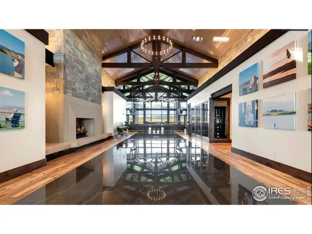 a open kitchen with a sink and a large window