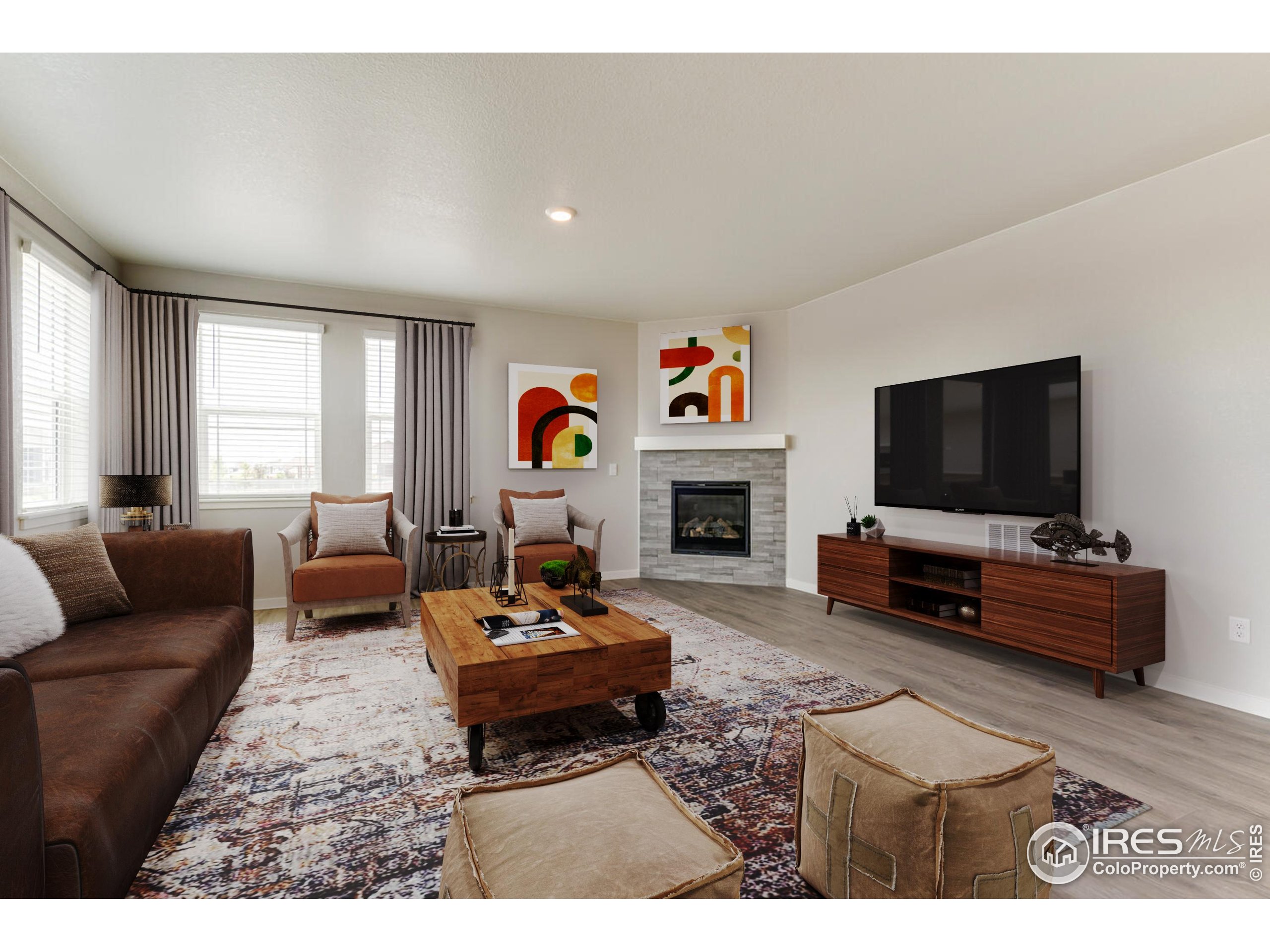 1894 Chaffee Crest Drive Berthoud, CO 80513 - Photo 3 of 31 a living room with furniture and a flat screen tv
