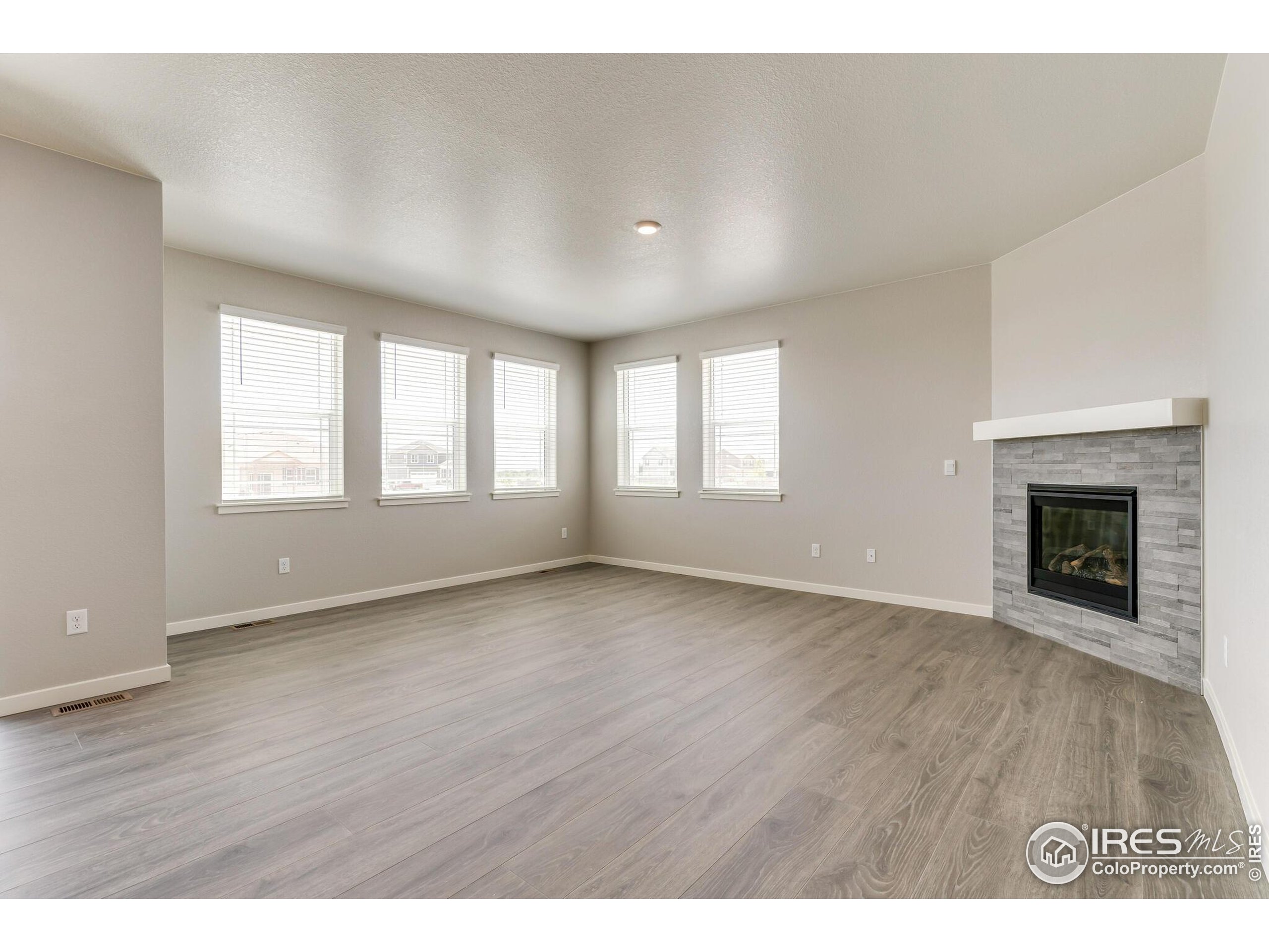 1894 Chaffee Crest Drive Berthoud, CO 80513 - Photo 8 of 31 a view of an empty room with wooden floor and a window